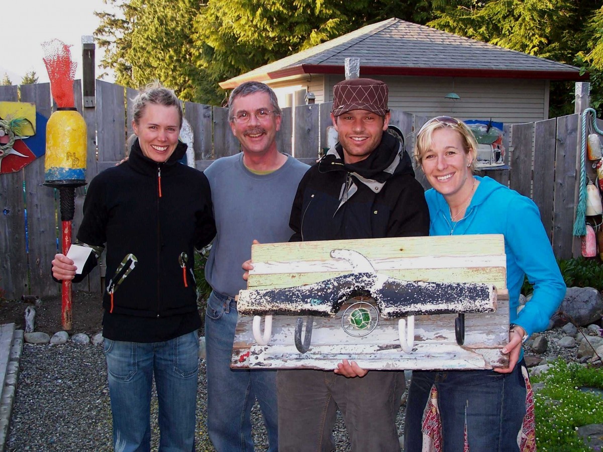 Artist Pete Clarkson pictured with 3 Canadian Olympians from 2010